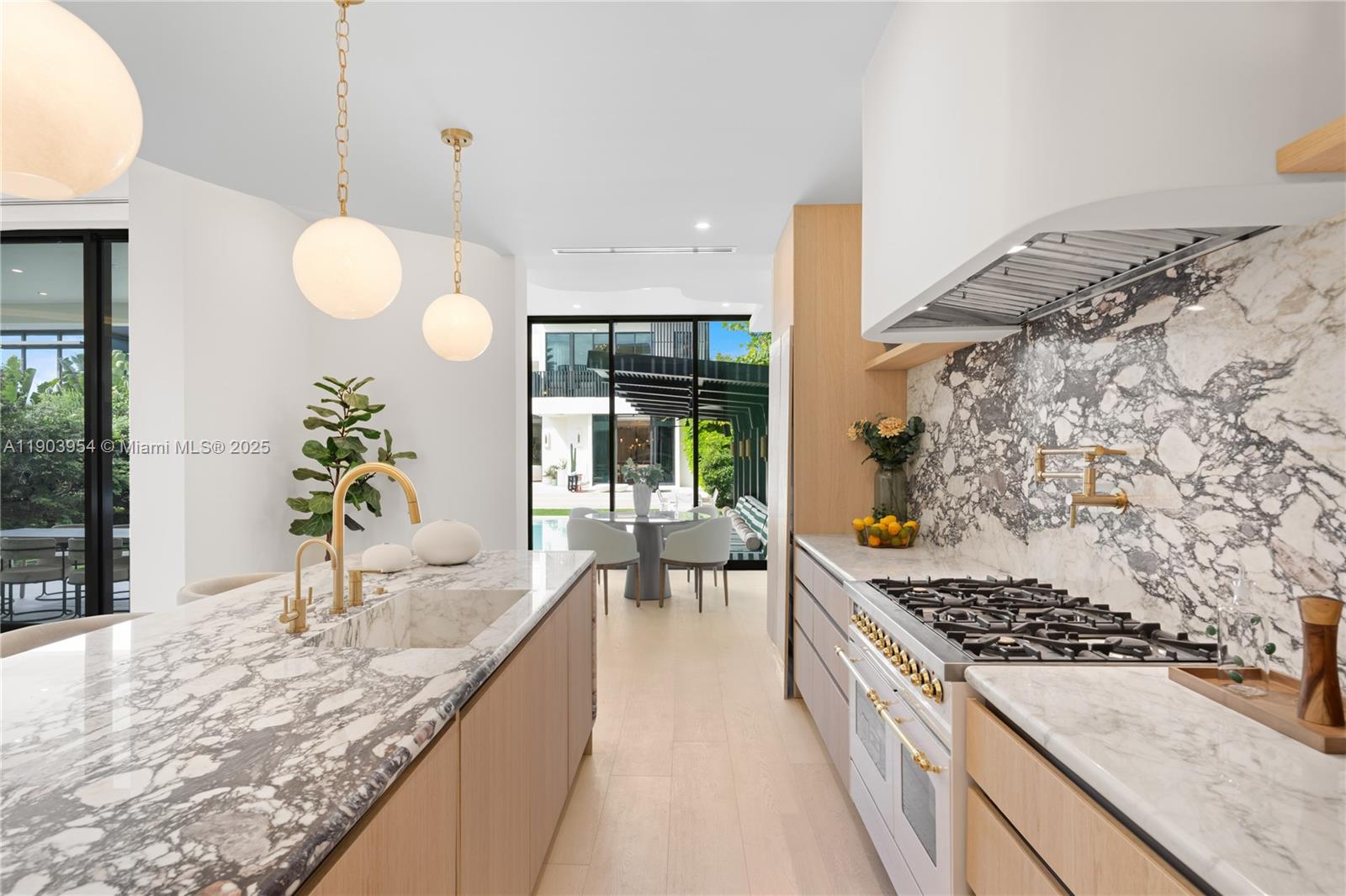 2053 North Bay Road Miami Beach, FL 33140 - Photo 69 of 99 a kitchen with a stove and a sink