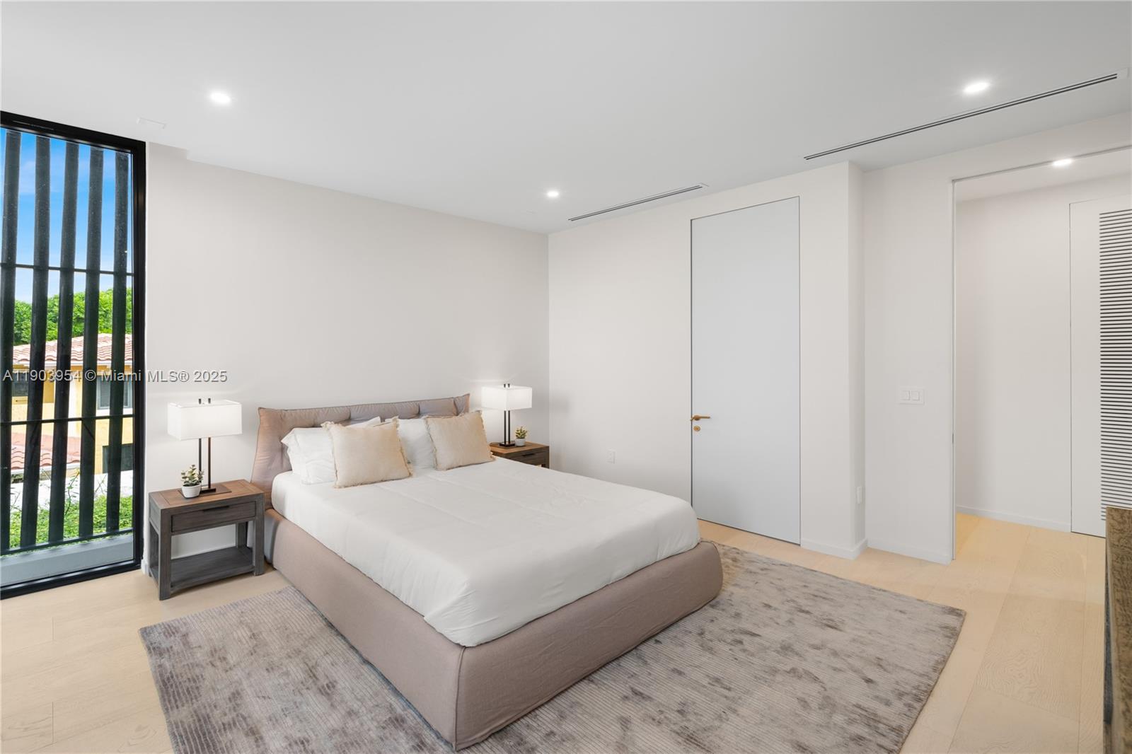 2053 North Bay Road Miami Beach, FL 33140 - Photo 85 of 99 a bedroom with a large bed and a rug