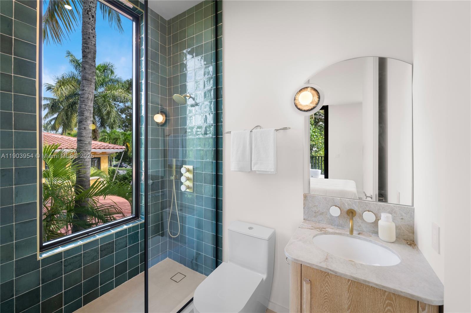 2053 North Bay Road Miami Beach, FL 33140 - Photo 86 of 99 a bathroom with a sink toilet and shower