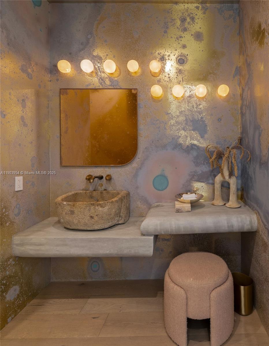 2053 North Bay Road Miami Beach, FL 33140 - Photo 9 of 99 a bathroom with a sink and a mirror