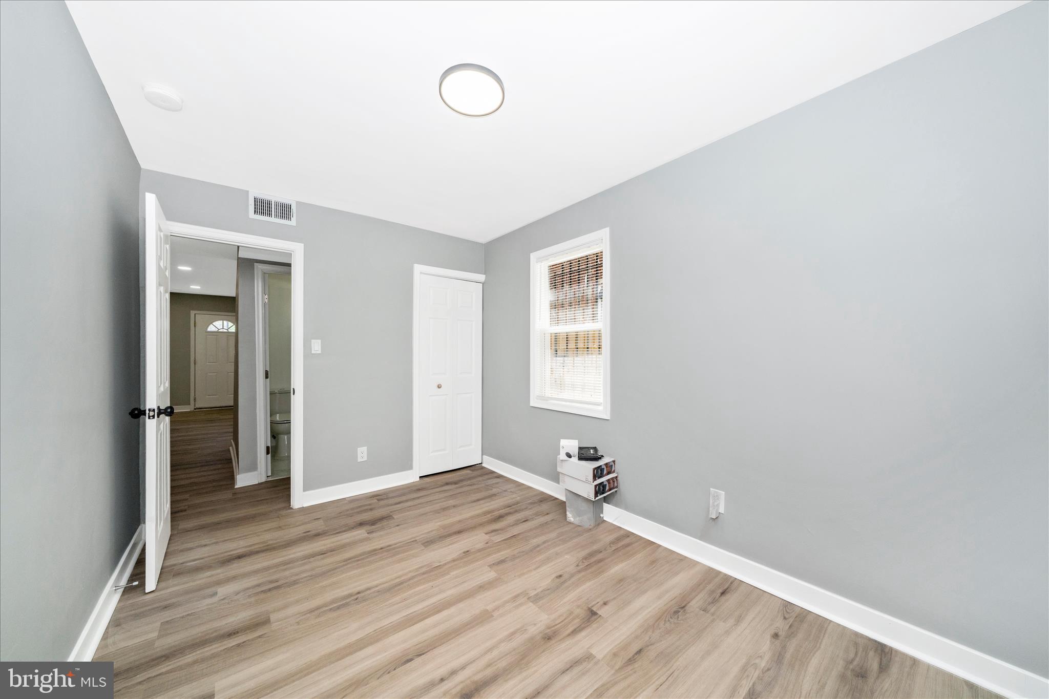 5027 Benning Road Southeast Washington, DC 20019 - Photo 27 of 57 a view of a room with wooden floor and a window