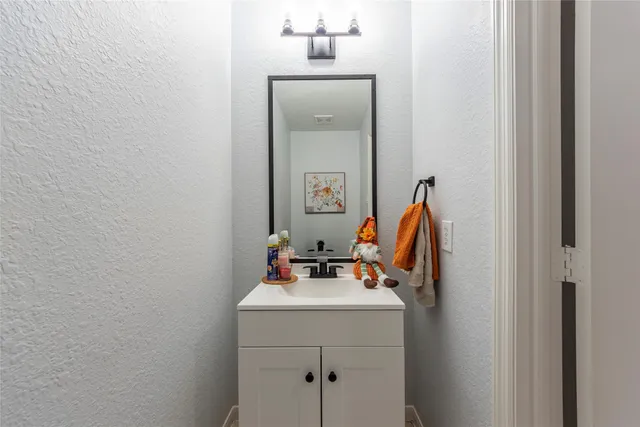 a view of a workspace with furniture and wooden floor