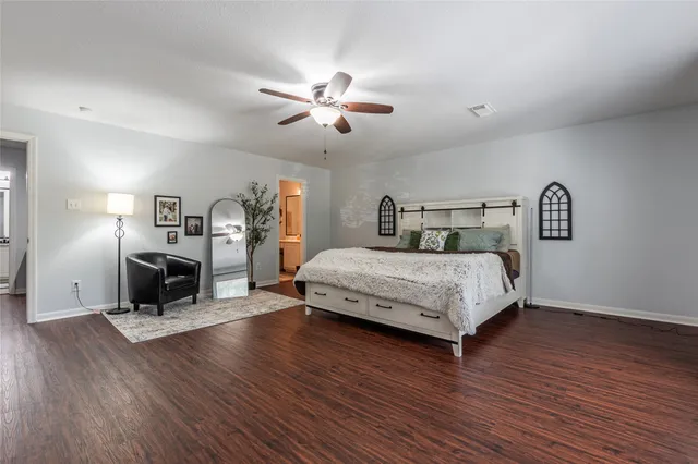 a view of walk in closet with clothes