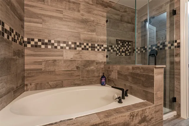 a bed room with furniture and a wooden floor