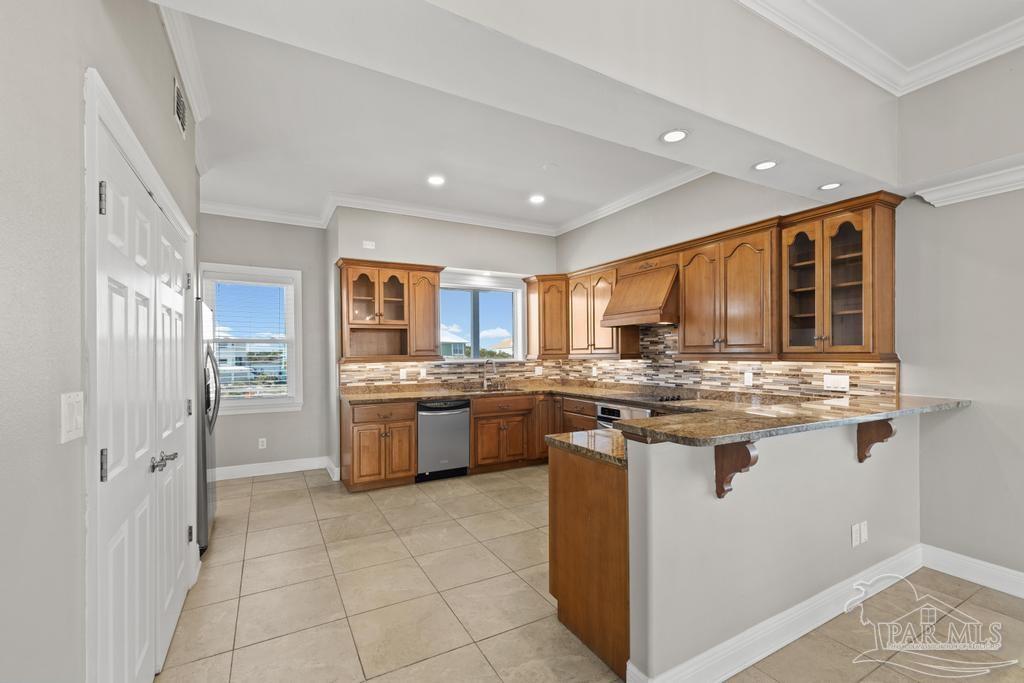 321 Gulfview Lane Perdido Key, FL 32507 - Photo 16 of 57 a kitchen with stainless steel appliances granite countertop a stove and a sink