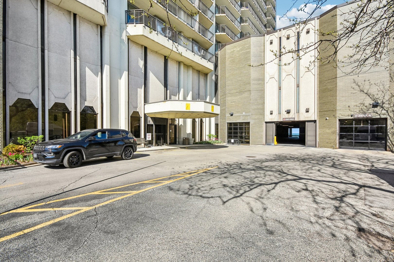 6007 North Sheridan Road, Unit 29F Chicago, IL 60660 - Photo 3 of 19 a view of a building with cars parked
