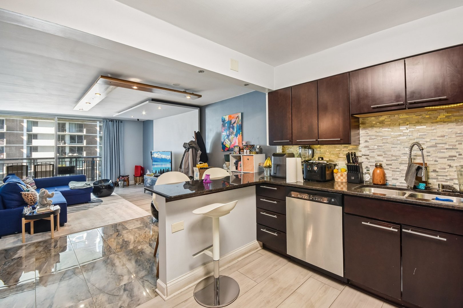 6007 North Sheridan Road, Unit 29F Chicago, IL 60660 - Photo 9 of 19 a kitchen with a sink cabinets and window