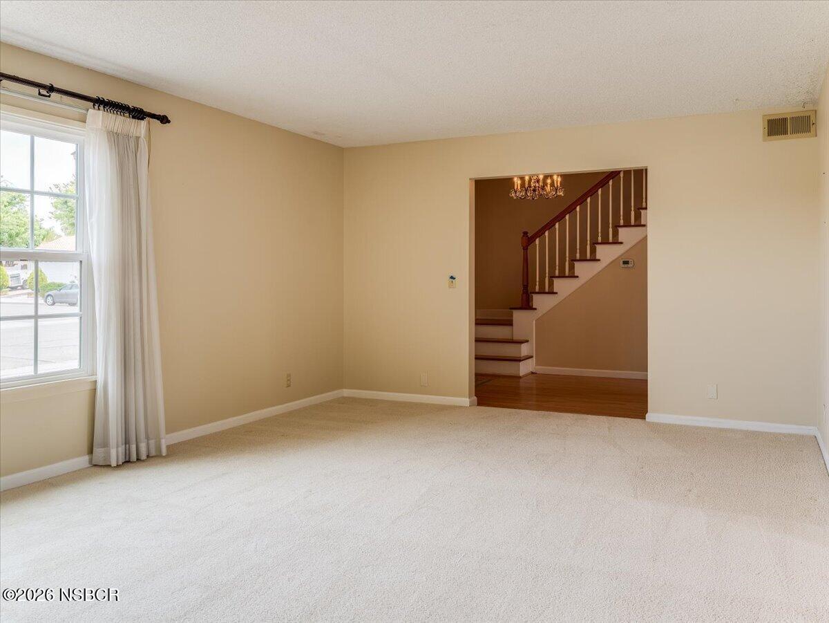 360 Tallyho Road Santa Maria, CA 93455 - Photo 13 of 72 an empty room with windows