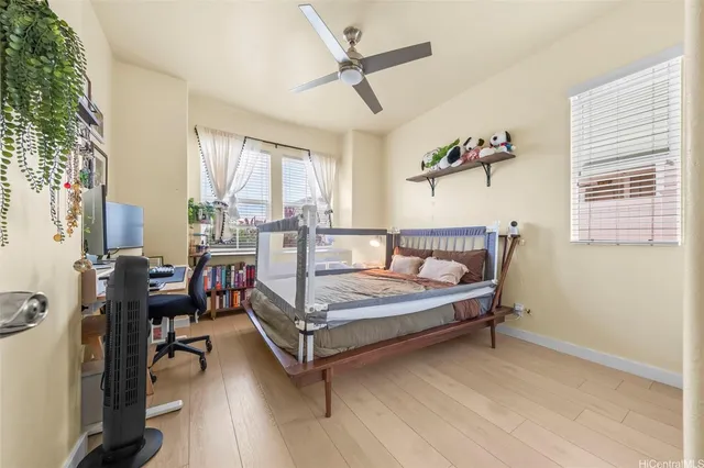 a view of a livingroom with furniture window and wooden floor