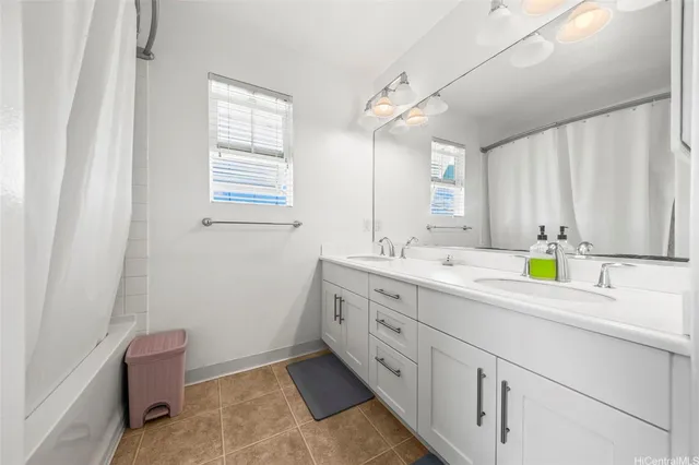 a bathroom with a granite countertop sink mirror and a