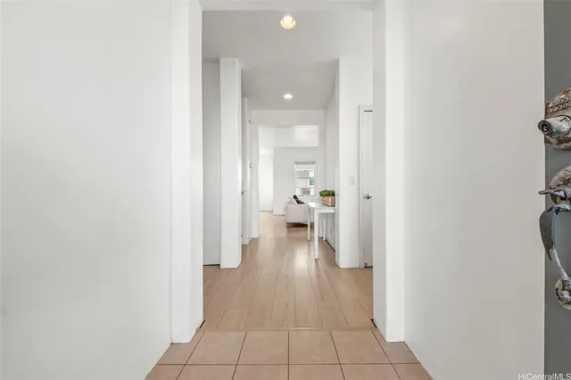 a view of a hallway with bathroom