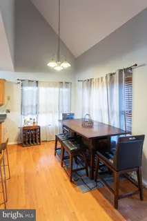 a view of a dining room with furniture and window