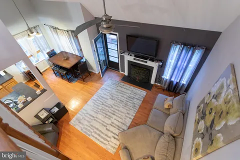 a living room with furniture fireplace and flat screen tv
