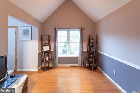 a view of a livingroom with furniture and a window