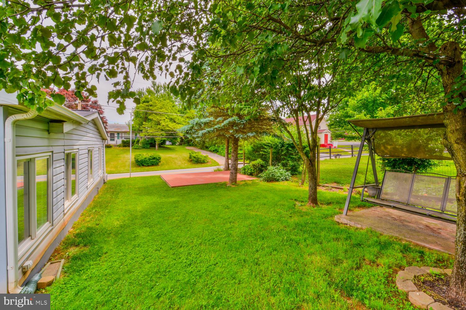 6034 Bartonsville Road Frederick, MD 21704 - Photo 53 of 56 Side of yard with patio and chair swing