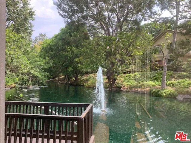 a view of lake with green space