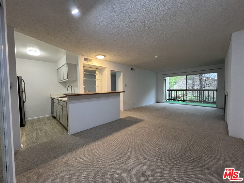 1115 Raintree Circle Culver City, CA 90230 - Photo 28 of 32 a view of a kitchen and a windows in a room