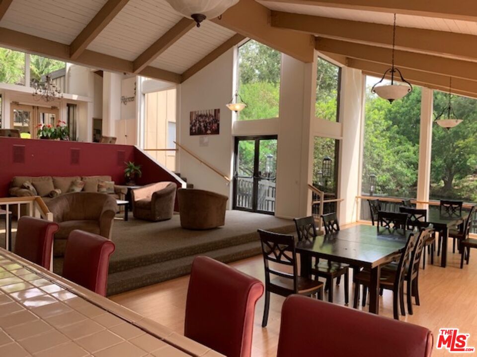 1115 Raintree Circle Culver City, CA 90230 - Photo 6 of 32 a view of a dining room with furniture window and outside view