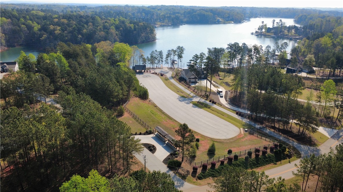 128 McAlister Road West Union, SC 29696 - Photo 33 of 40 An aerial perspective reveals a serene lakefront community nestled amidst lush woodlands.