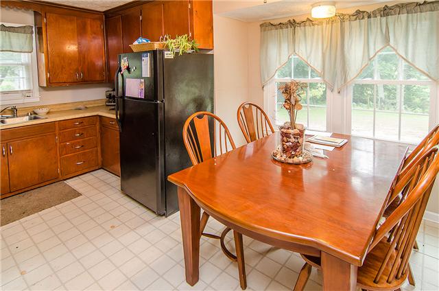 3463 Catholic Church Road Cedar Hill, TN 37032 - Photo 15 of 19 Tiled kitchen with nicely placed windows