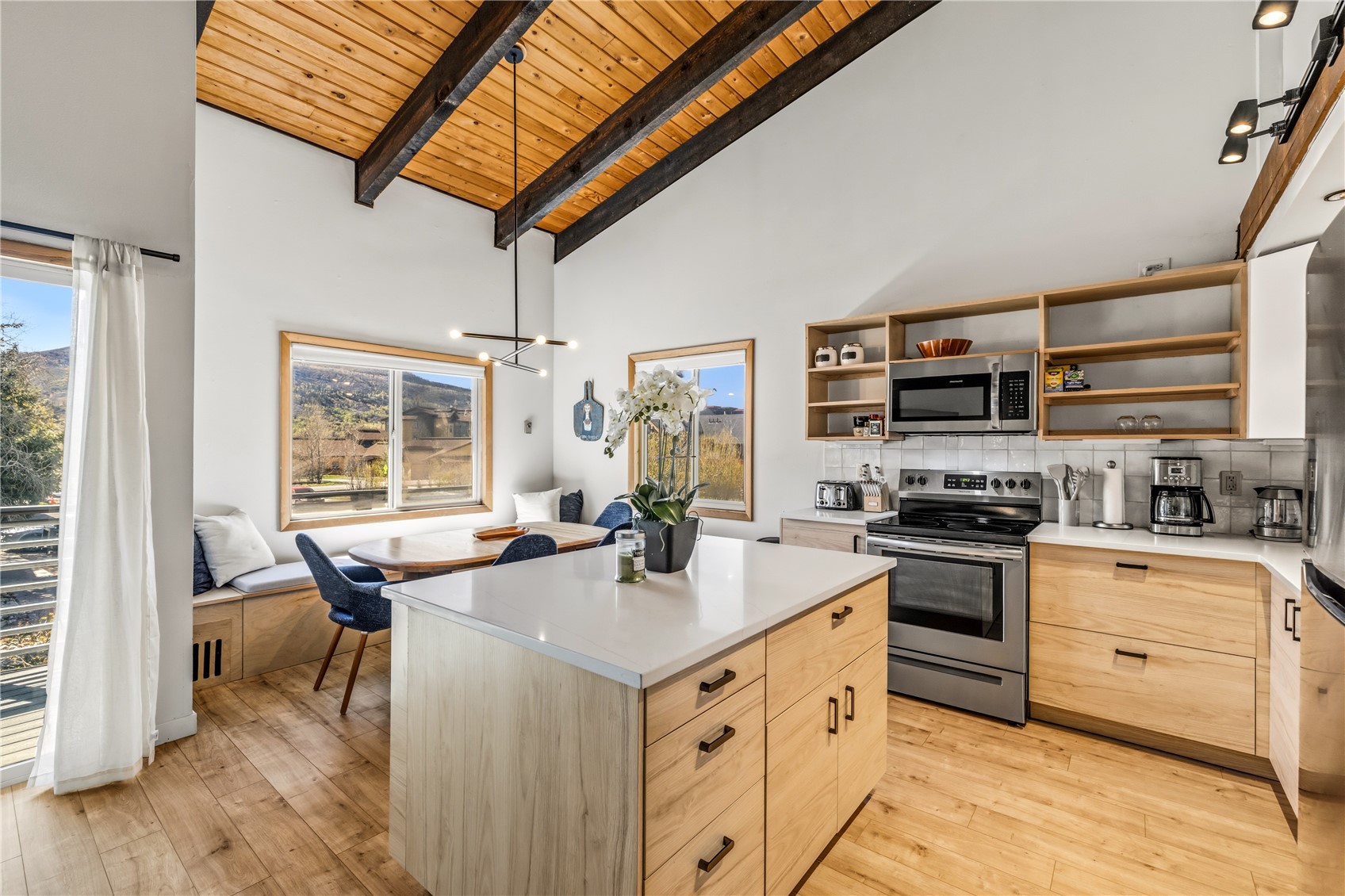 1375 Walton Creek Road, Unit 14 Steamboat Springs, CO 80487 - Photo 11 of 38 a kitchen with stainless steel appliances granite countertop a sink stove and refrigerator