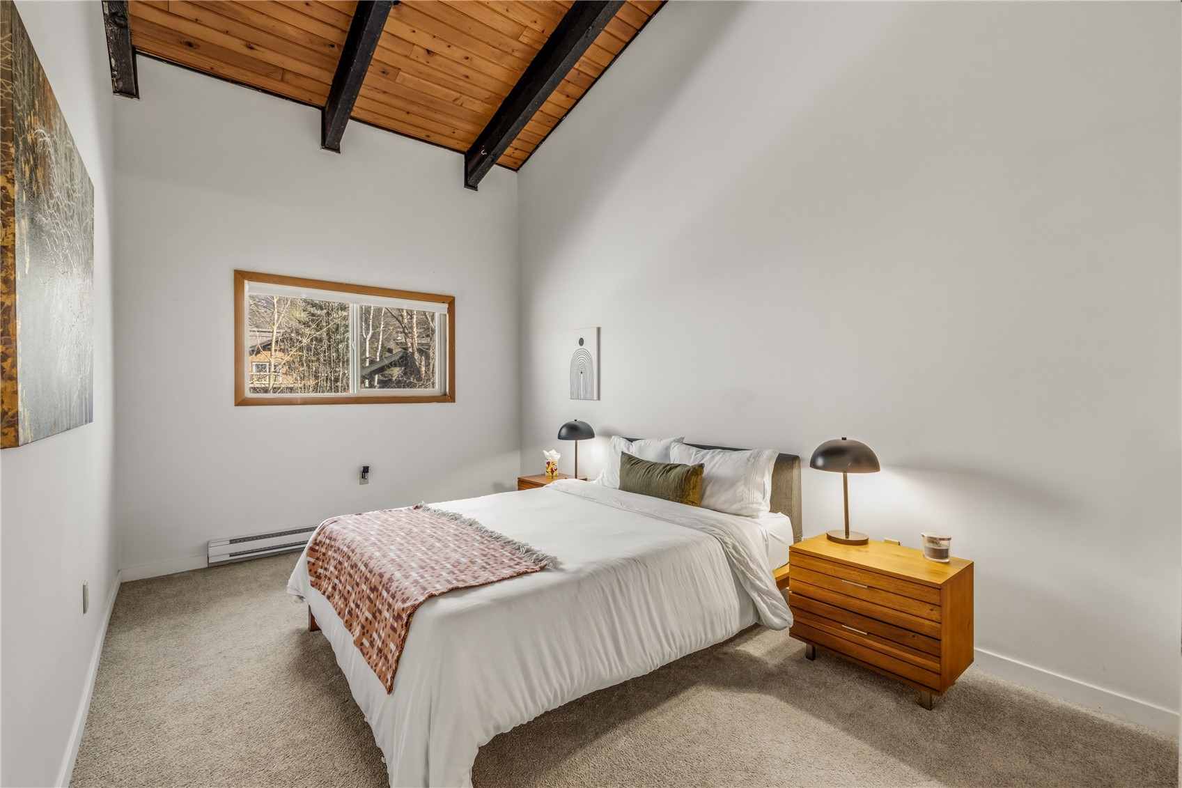 1375 Walton Creek Road, Unit 14 Steamboat Springs, CO 80487 - Photo 12 of 38 a bedroom with a bed and a couch