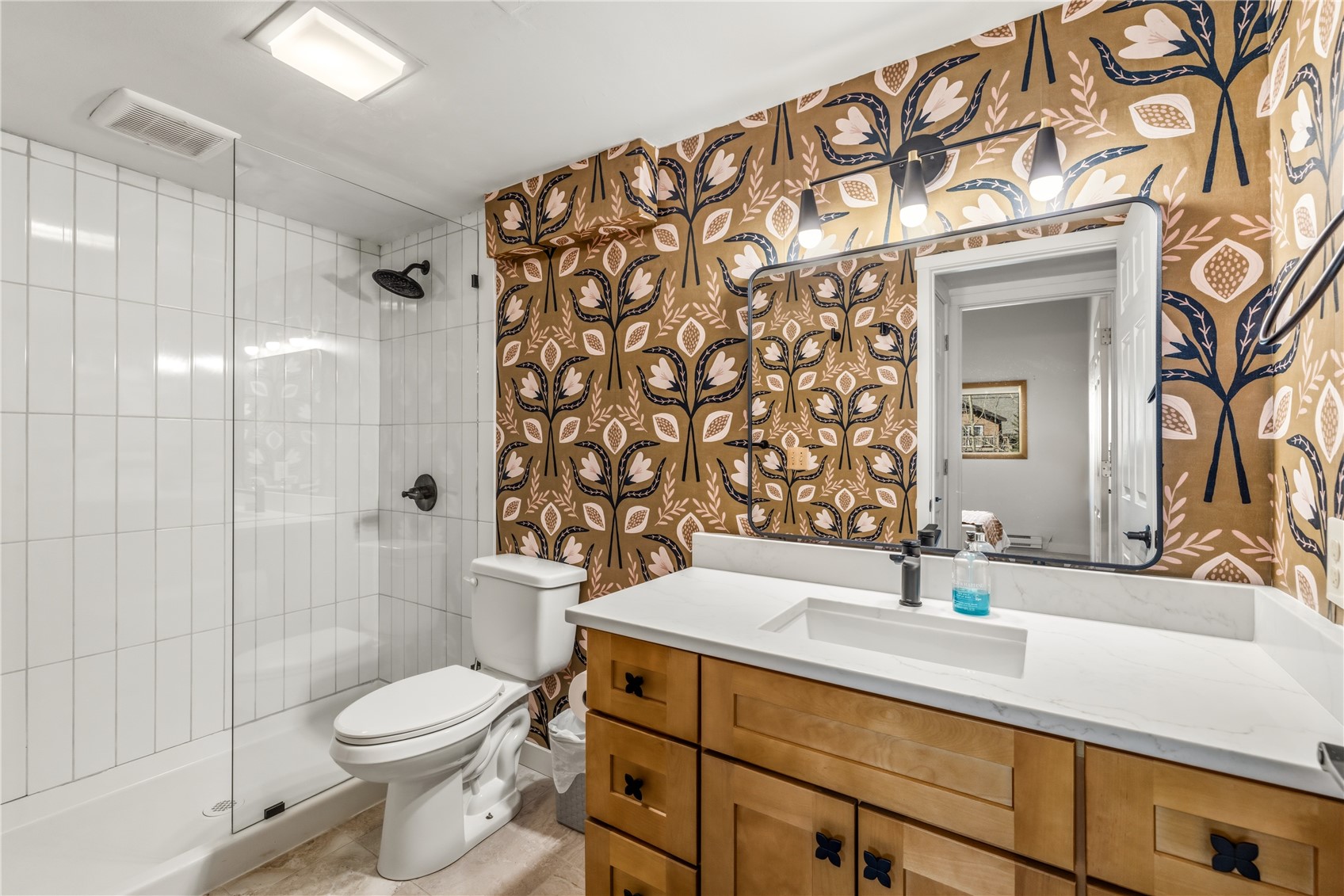 1375 Walton Creek Road, Unit 14 Steamboat Springs, CO 80487 - Photo 15 of 38 a bathroom with a sink toilet and shower