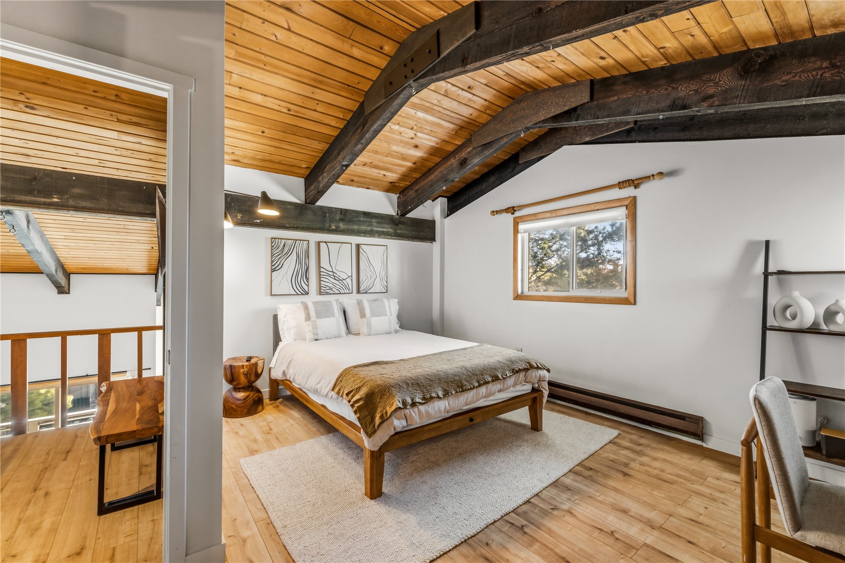 1375 Walton Creek Road, Unit 14 Steamboat Springs, CO 80487 - Photo 21 of 38 a bedroom with a bed and wooden floor