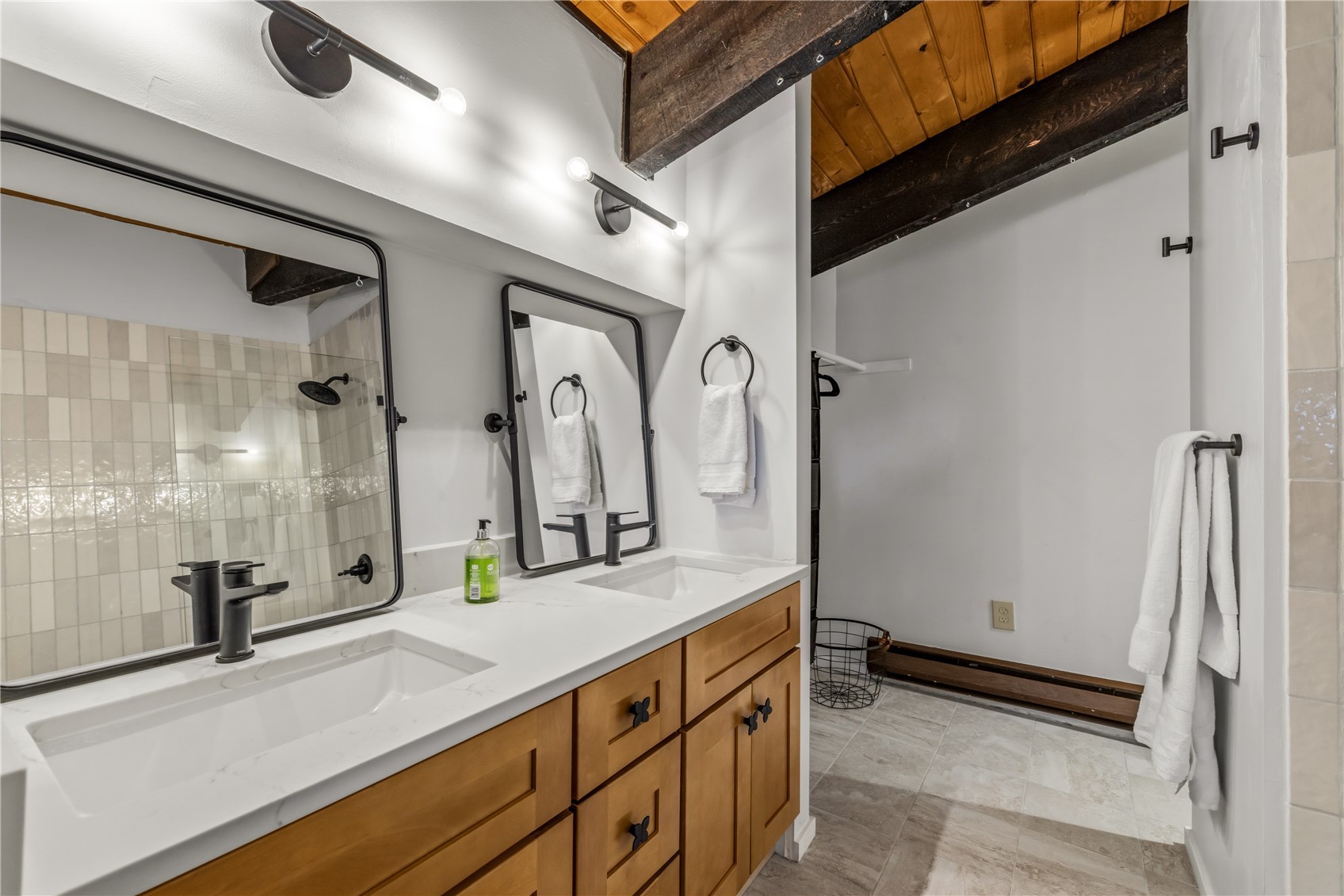 1375 Walton Creek Road, Unit 14 Steamboat Springs, CO 80487 - Photo 24 of 38 a bathroom with a double vanity sink and a mirror