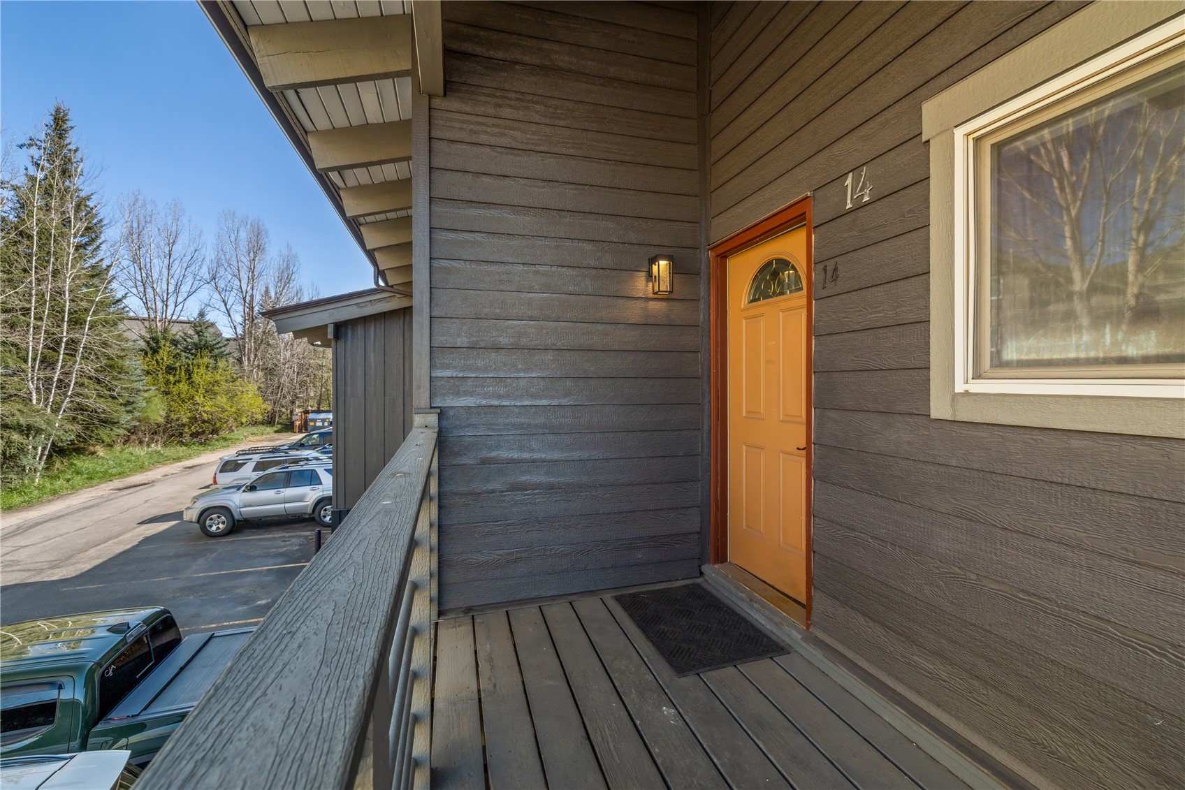1375 Walton Creek Road, Unit 14 Steamboat Springs, CO 80487 - Photo 33 of 38 a view of balcony with wooden floor and fence