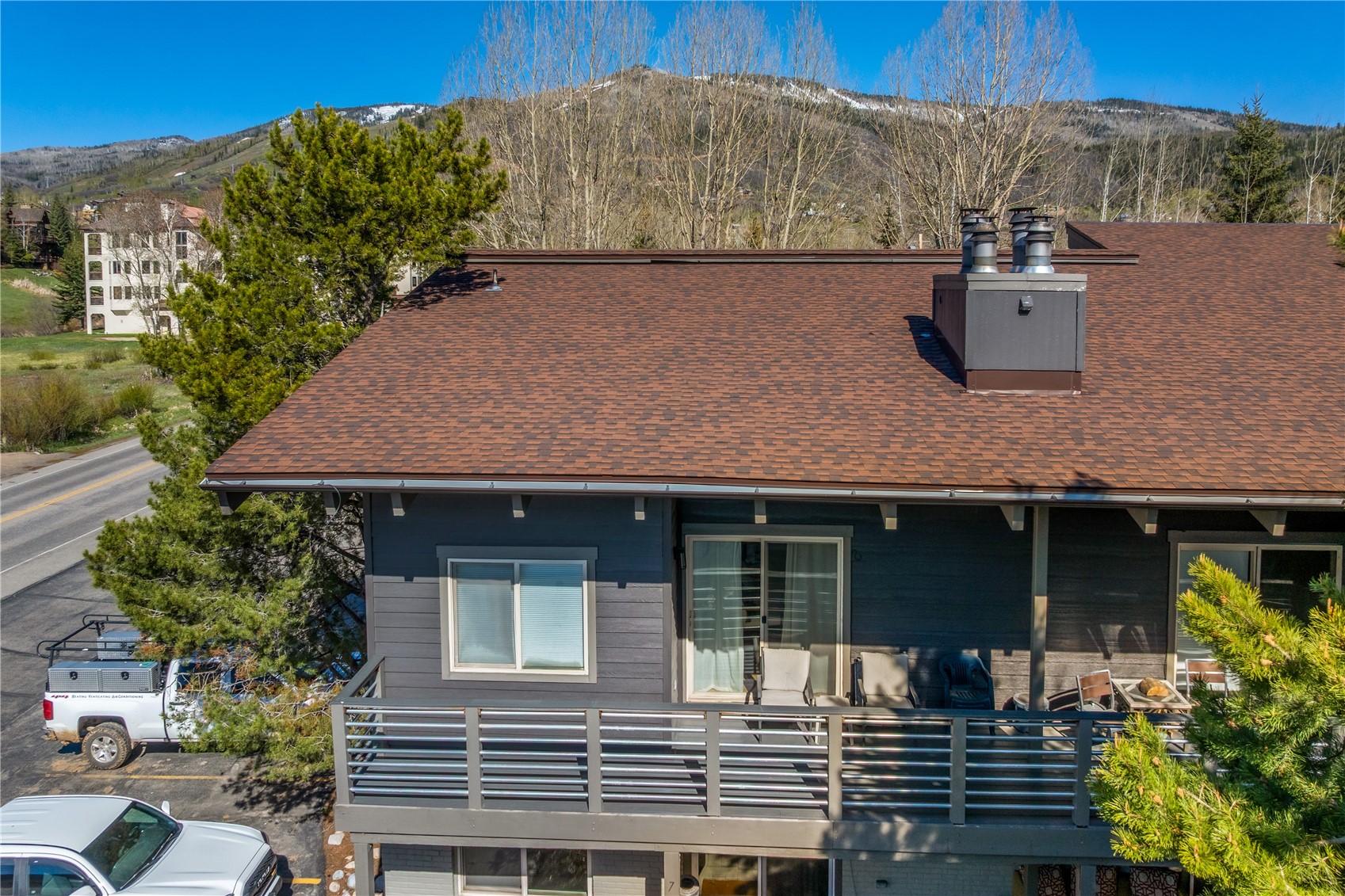 1375 Walton Creek Road, Unit 14 Steamboat Springs, CO 80487 - Photo 37 of 38 an aerial view of a house with a yard and sitting area