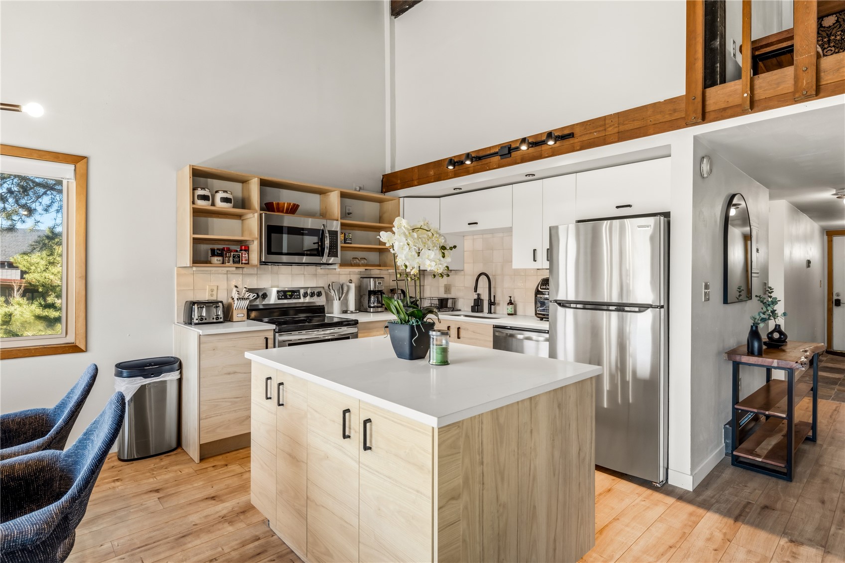 1375 Walton Creek Road, Unit 14 Steamboat Springs, CO 80487 - Photo 8 of 38 a kitchen that has a lot of cabinets a sink and appliances