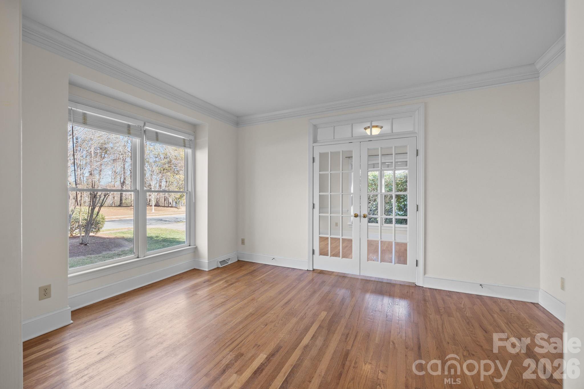 100 Martin Street Davidson, NC 28036 - Photo 17 of 47 wooden floor in an empty room with a window