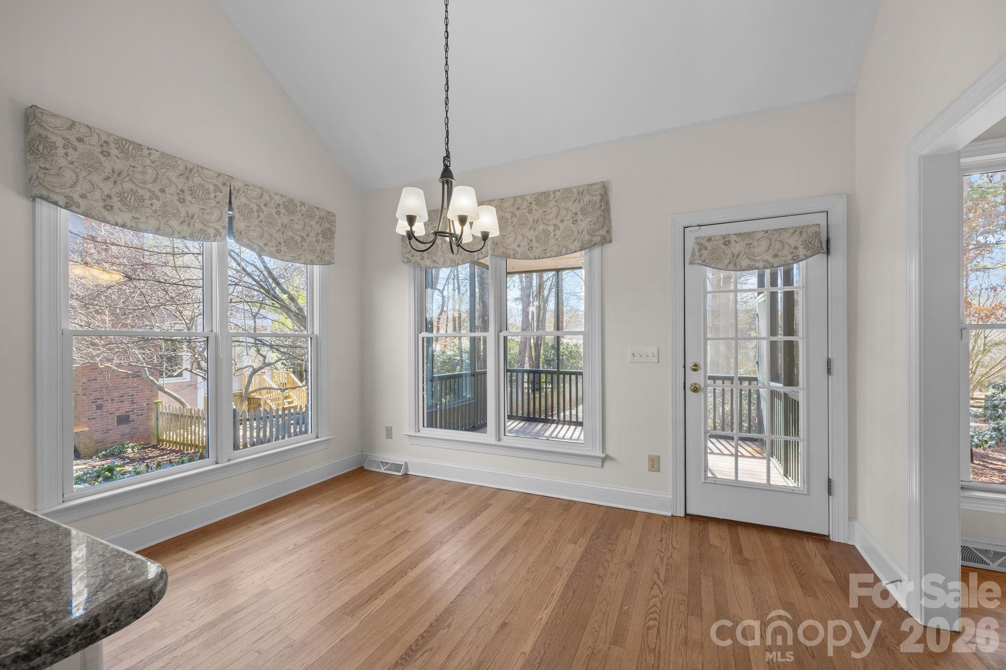 100 Martin Street Davidson, NC 28036 - Photo 25 of 47 a view of an empty room with wooden floor and a window