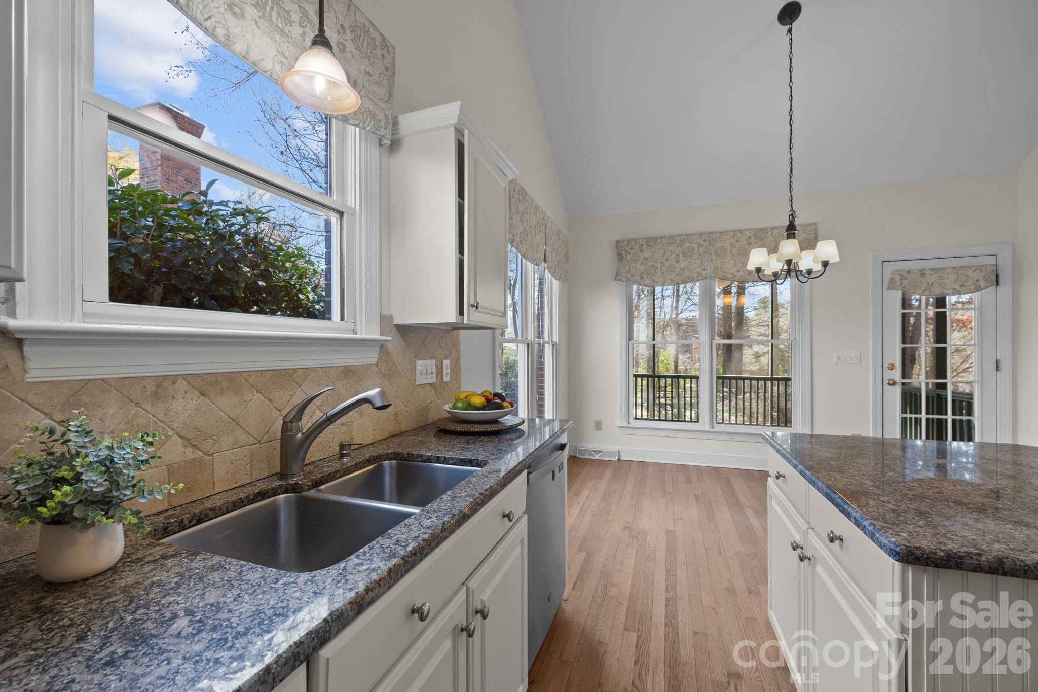100 Martin Street Davidson, NC 28036 - Photo 29 of 47 a kitchen with a sink a counter space and a window