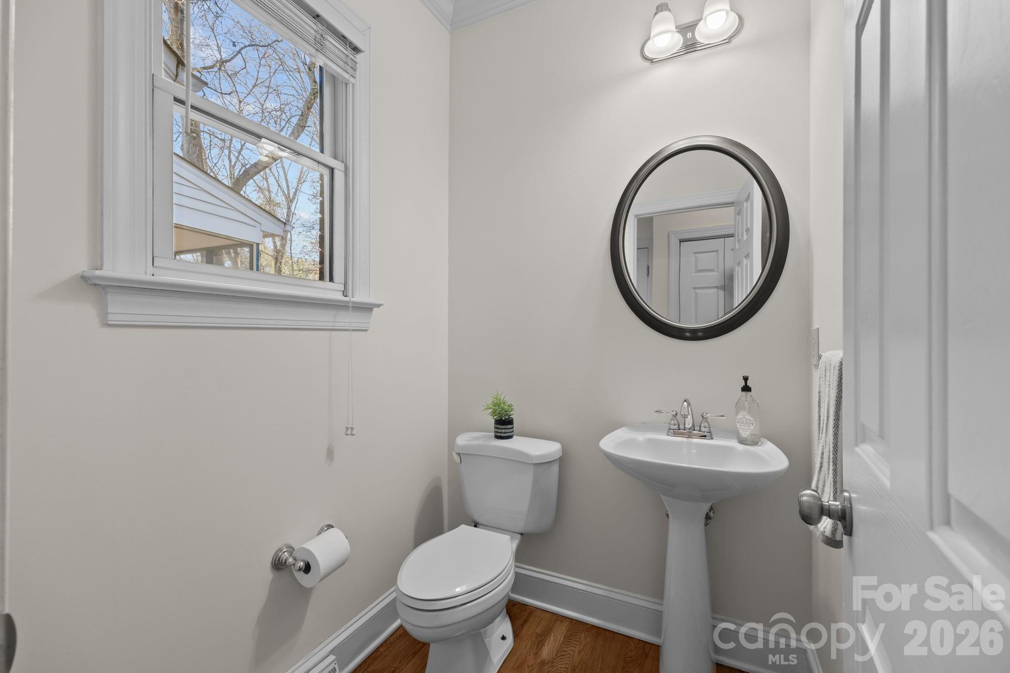 100 Martin Street Davidson, NC 28036 - Photo 34 of 47 a bathroom with a toilet sink and mirror