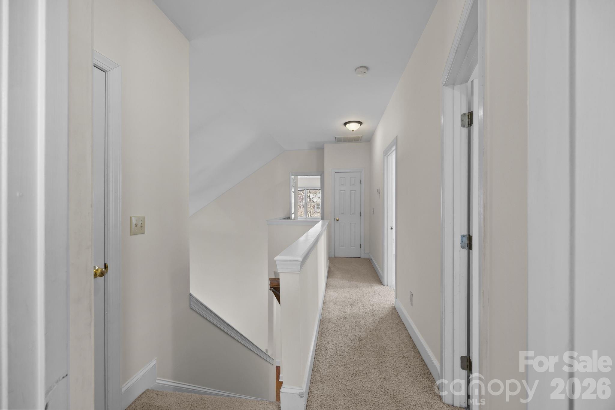 100 Martin Street Davidson, NC 28036 - Photo 40 of 47 a view of a hallway with closet and wooden floor