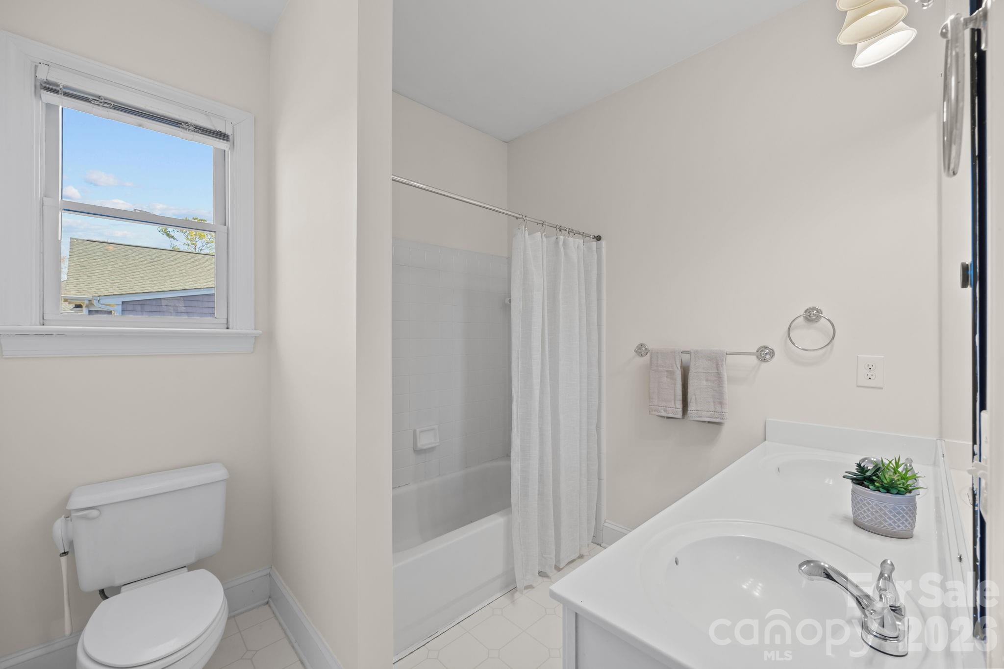 100 Martin Street Davidson, NC 28036 - Photo 41 of 47 a bathroom with a sink a toilet and shower