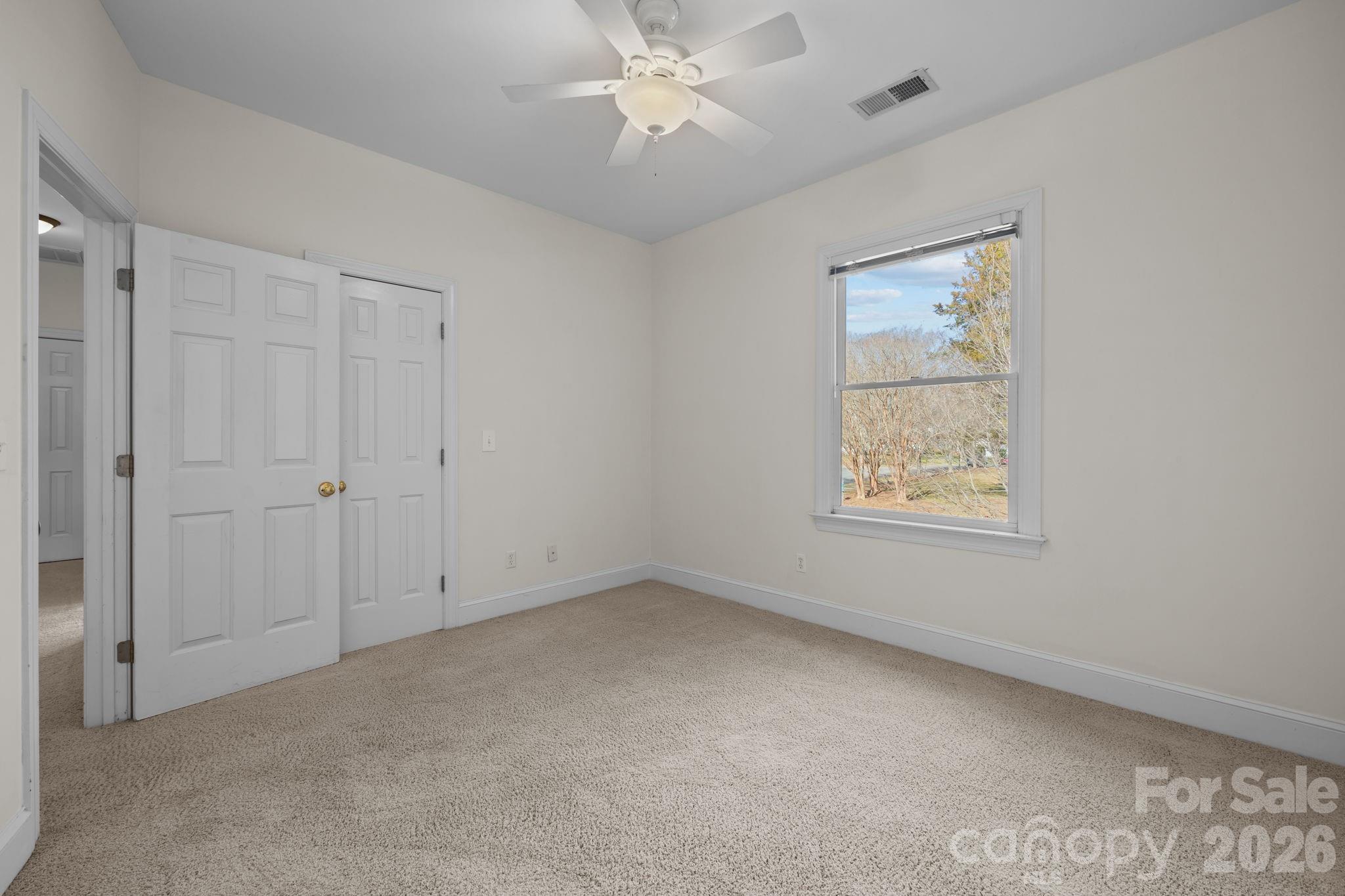100 Martin Street Davidson, NC 28036 - Photo 44 of 47 an empty room with a window and a fan