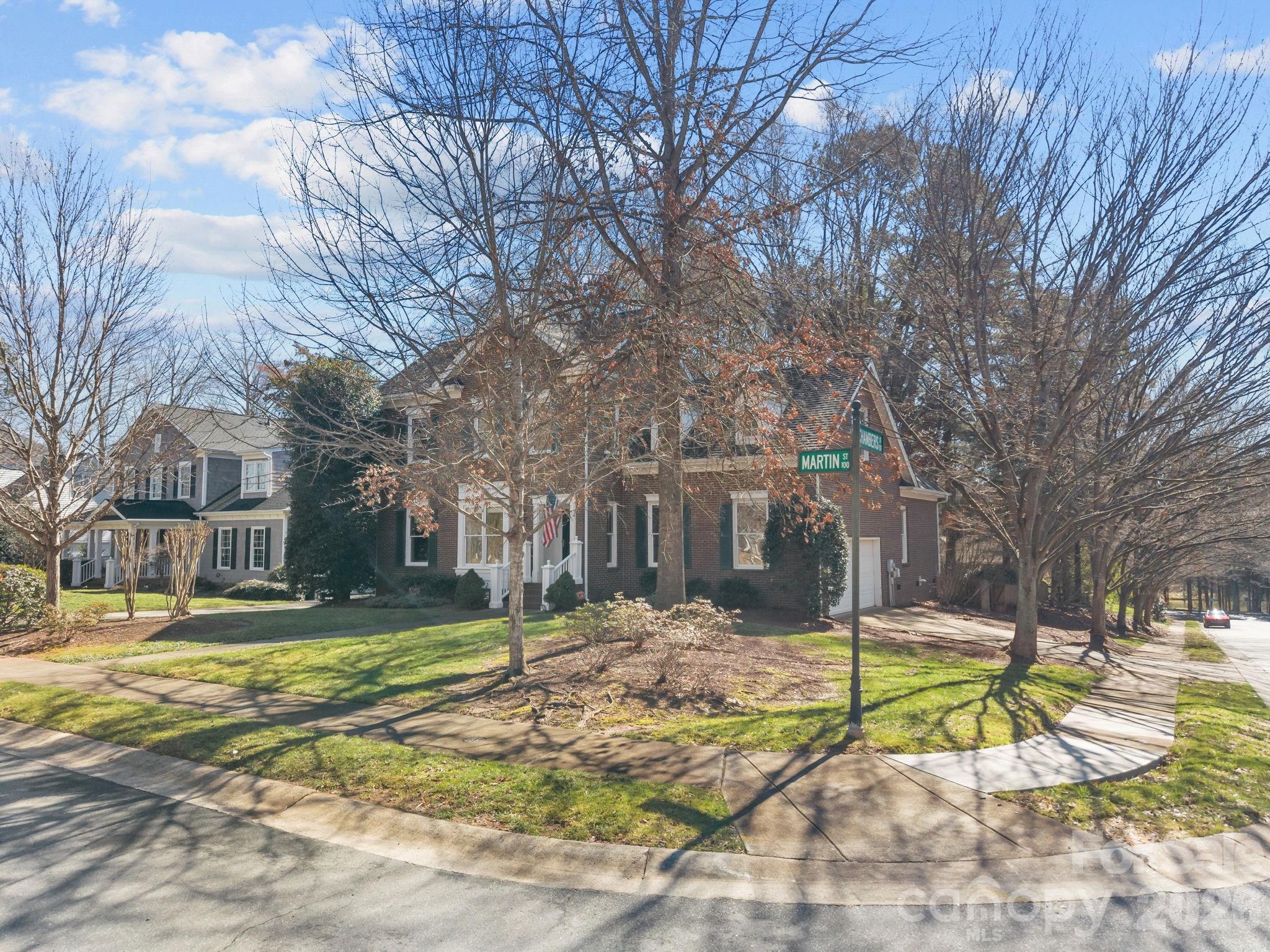 100 Martin Street Davidson, NC 28036 - Photo 7 of 47 a view of a house with snow on the side of the road