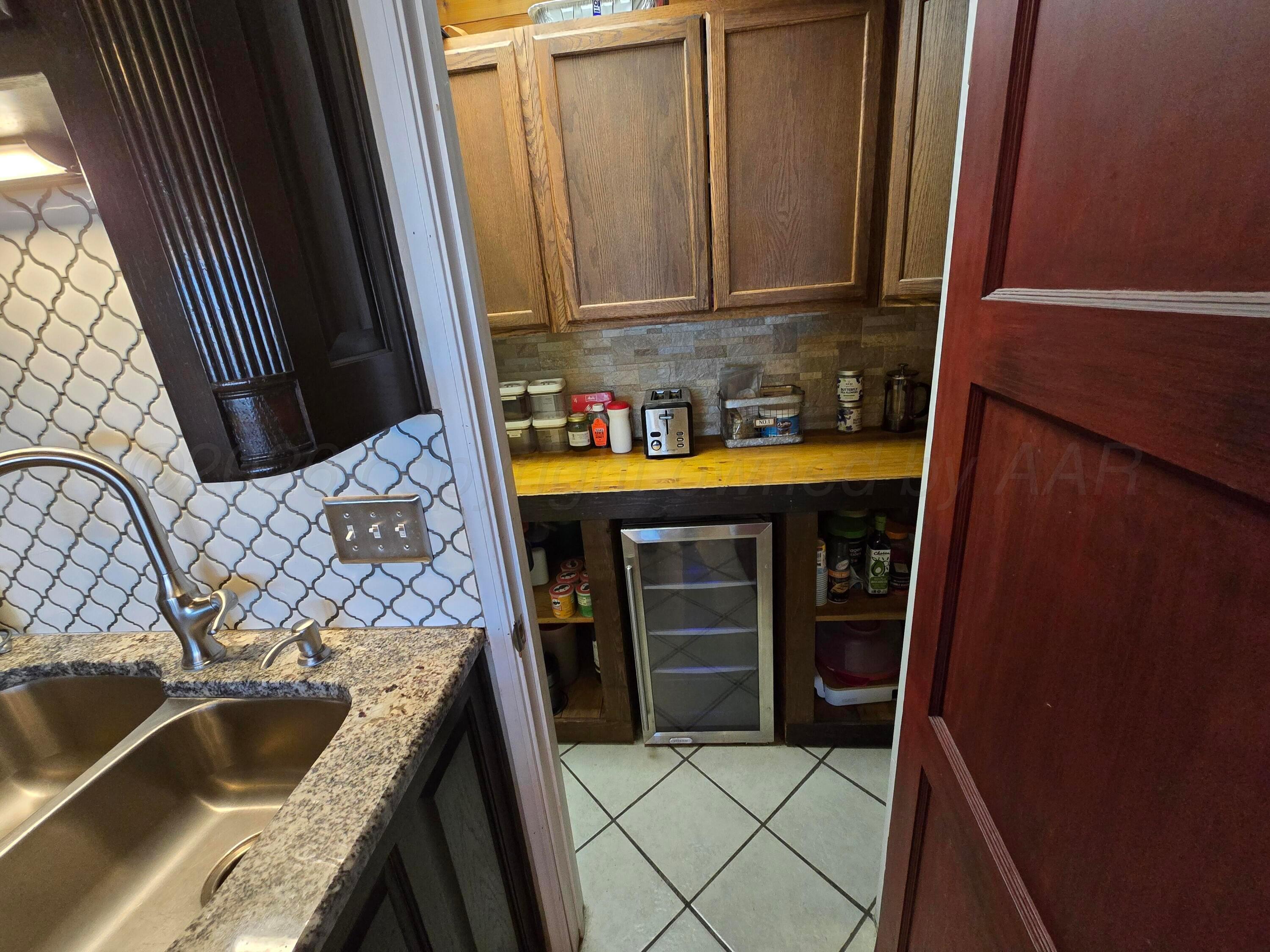 1121 Elmore Street Borger, TX 79007 - Photo 21 of 39 a view of storage and utility room
