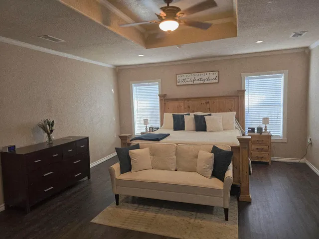 a bedroom with a bed and a dresser