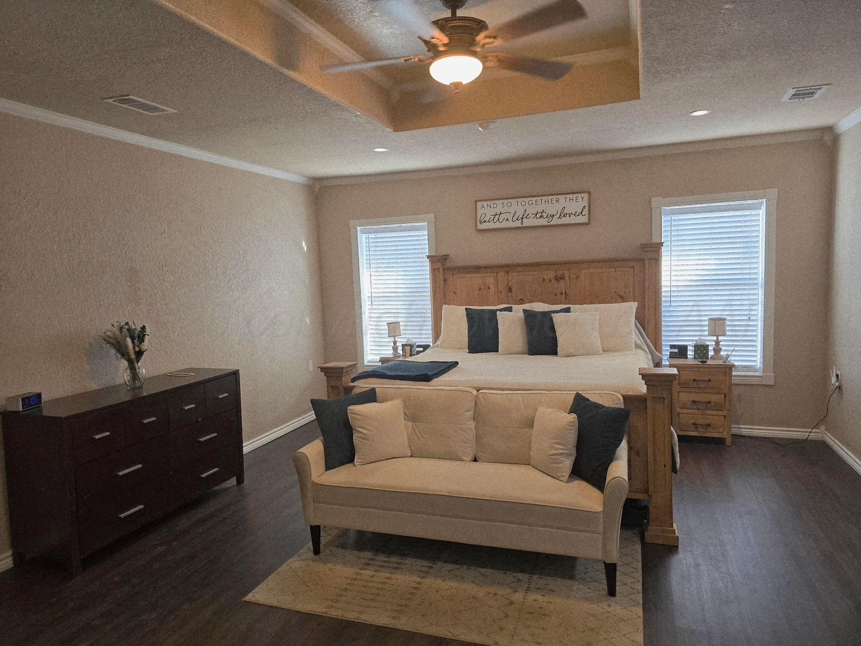 1121 Elmore Street Borger, TX 79007 - Photo 28 of 39 a bedroom with a bed and a dresser