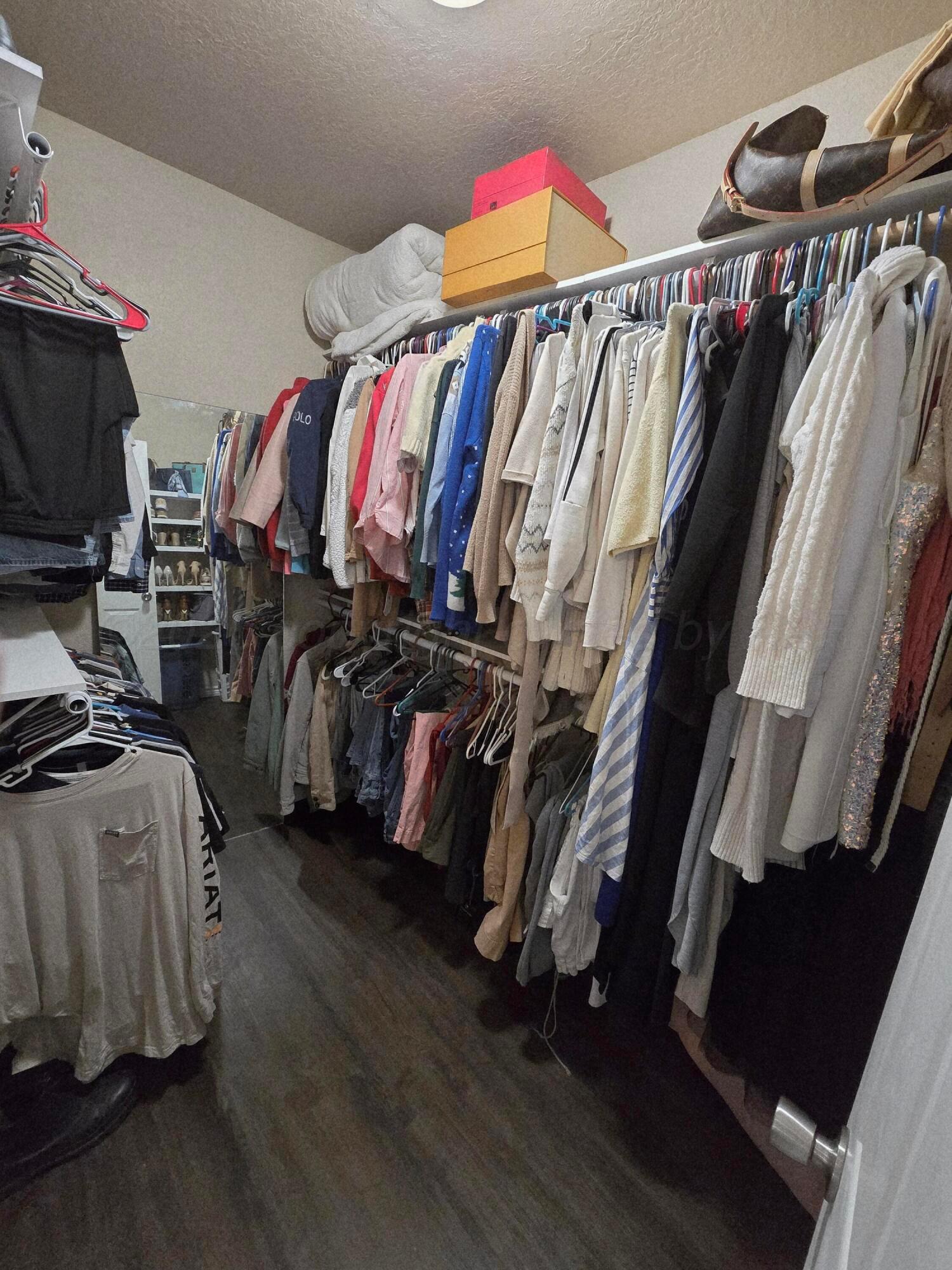 1121 Elmore Street Borger, TX 79007 - Photo 30 of 39 a view of walk in closet with clothes and shoes