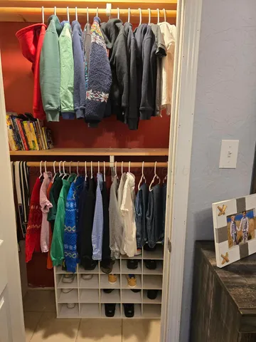 a dining room with furniture and a flat screen tv