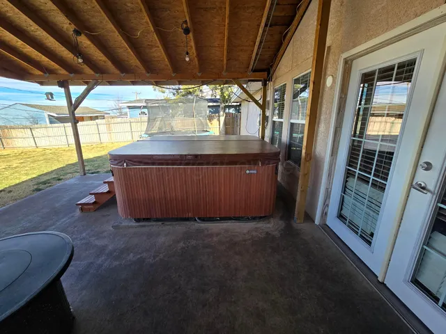 a view of a room with wooden walls