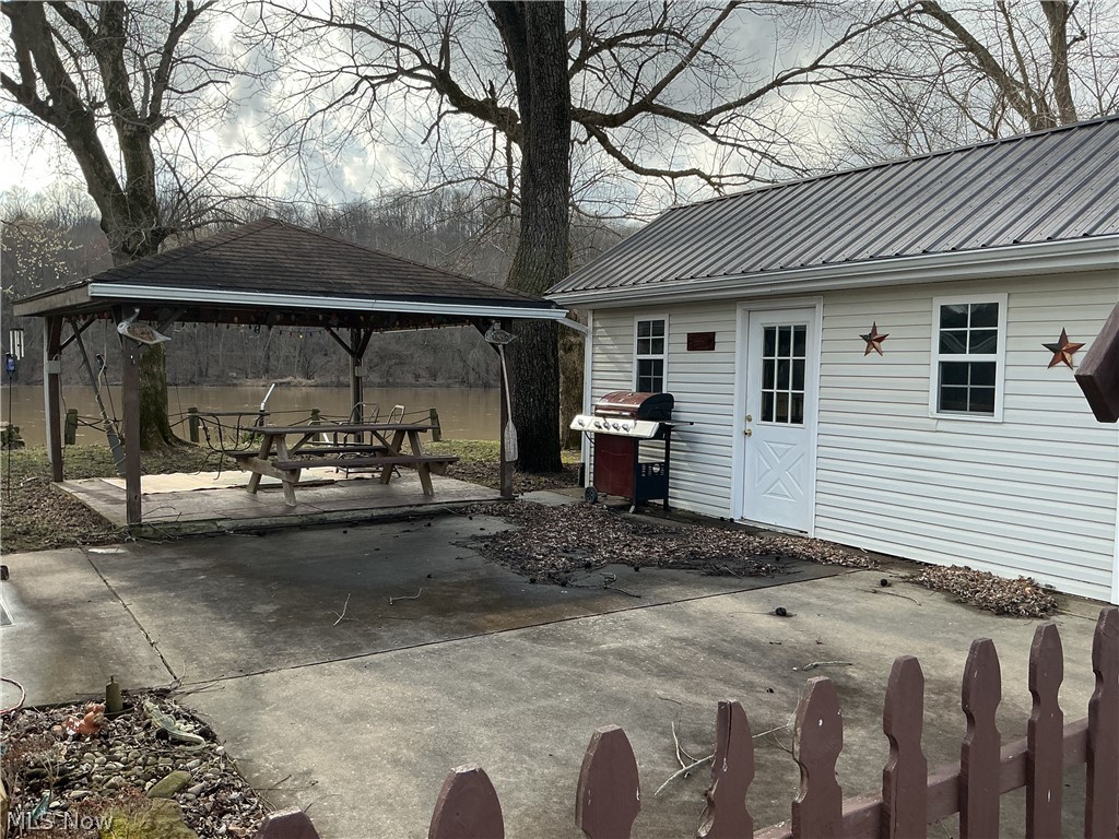9385 North River Road East, Unit 33 Dresden, OH 43821 - Photo 8 of 19 View of patio featuring a gazebo, area for grilling, and an outdoor structure