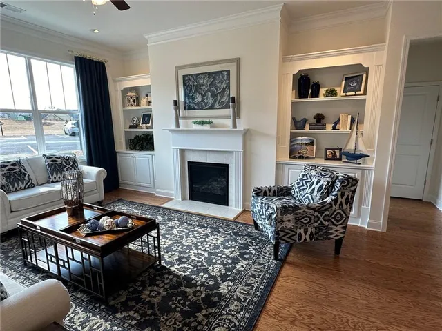 a living room with furniture rug and window