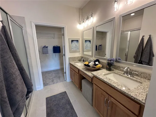 a large bathroom with a sink and a mirror