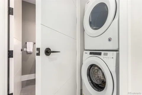 a close view of a utility room with dryer and washer
